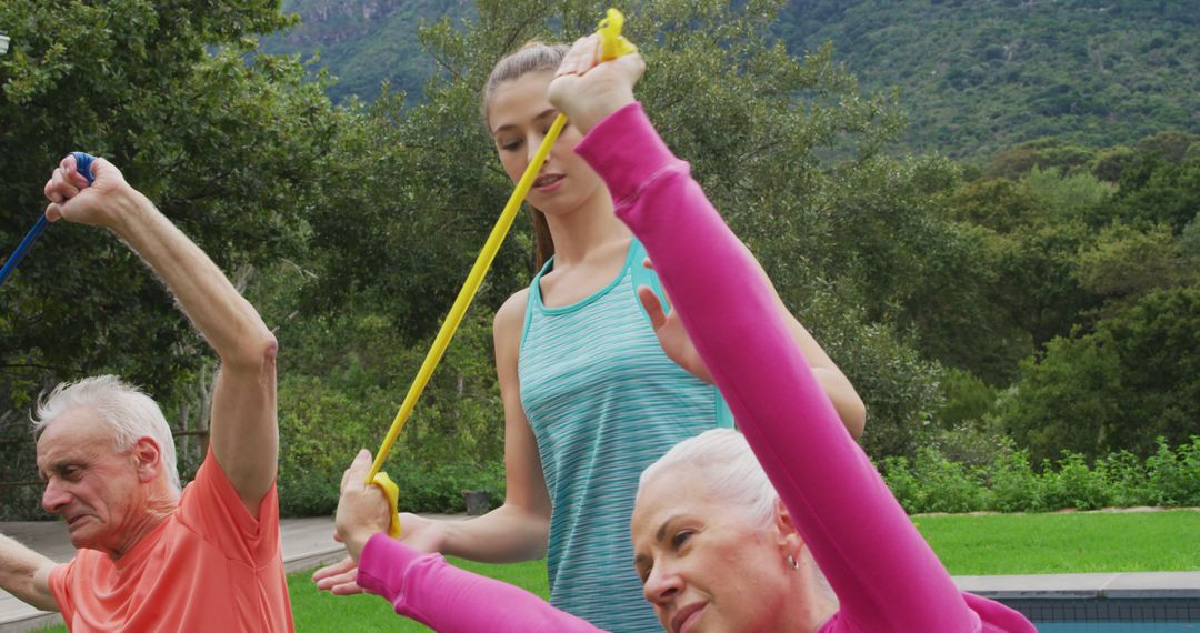 Senior Adults Exercising with Resistance Bands Outdoors - Free Images, Stock Photos and Pictures on Pikwizard.com