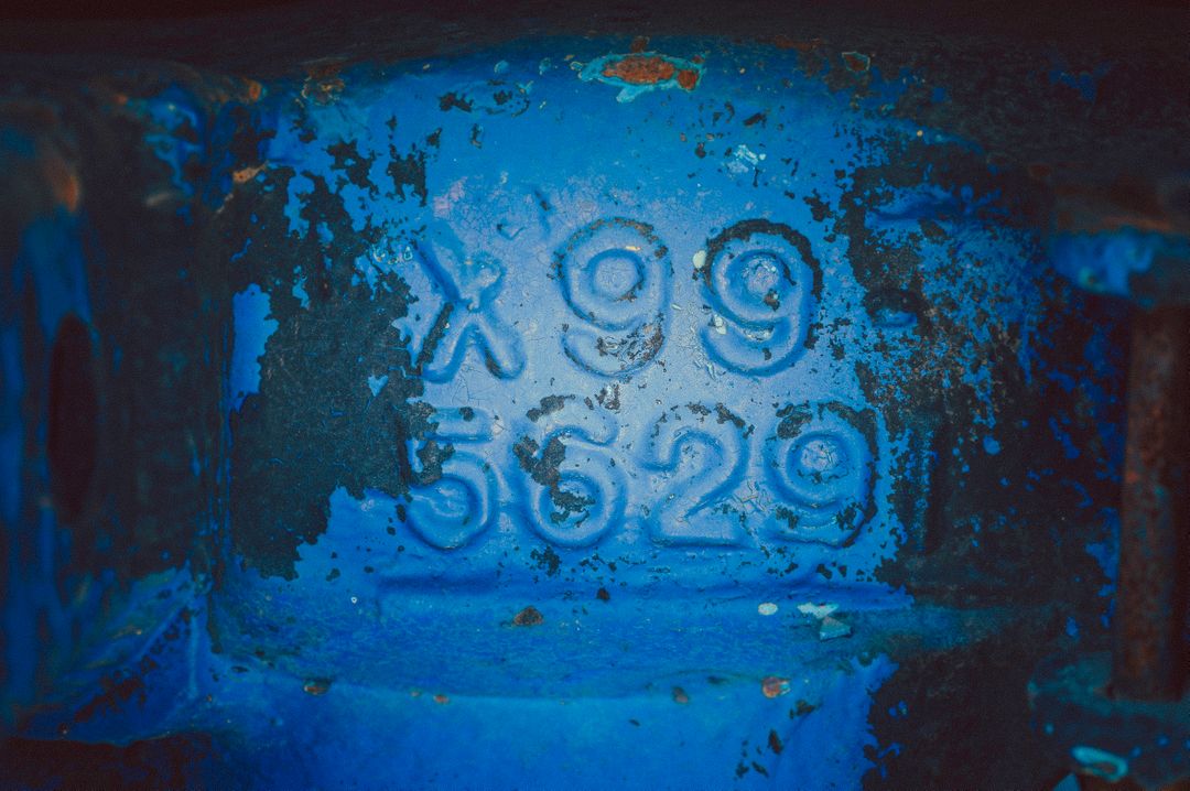 Close-up of Blue Industrial Engraved Metal with X99 5629 - Free Images, Stock Photos and Pictures on Pikwizard.com