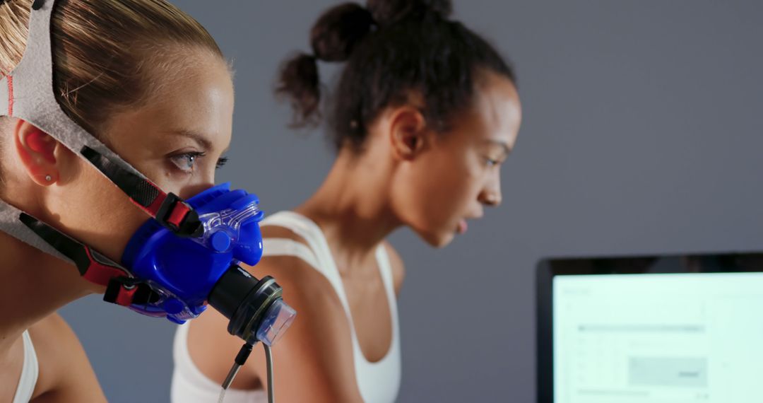 Female Athletes Undergoing Respiratory Fitness Test in Laboratory - Free Images, Stock Photos and Pictures on Pikwizard.com