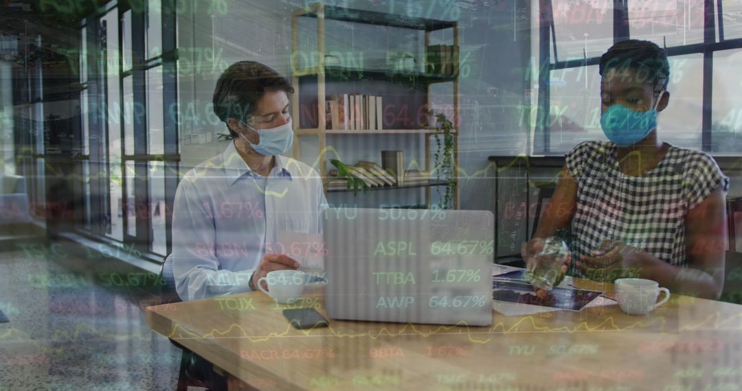 Diverse Coworkers Practicing Safety with Masks and Sanitizer in Office