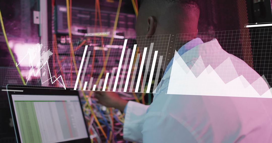 IT Technician Monitoring Server Data in Modern Data Center