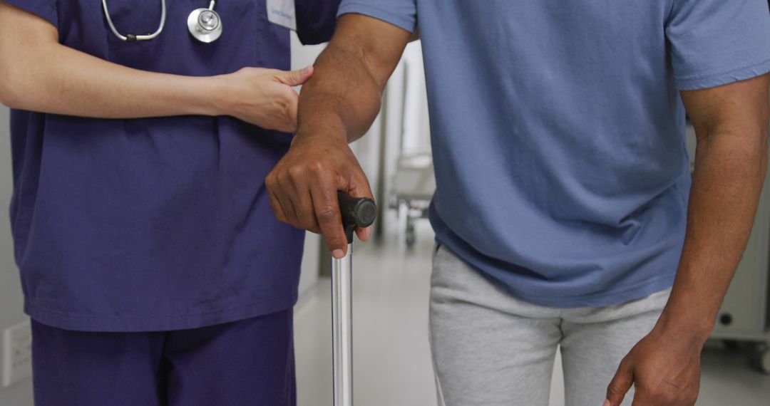 Nurse Assisting Male Patient Walking With Cane - Free Images, Stock Photos and Pictures on Pikwizard.com