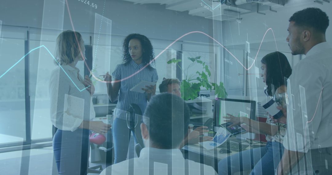 Diverse Coworkers Discussing Digital Reports in Modern Office