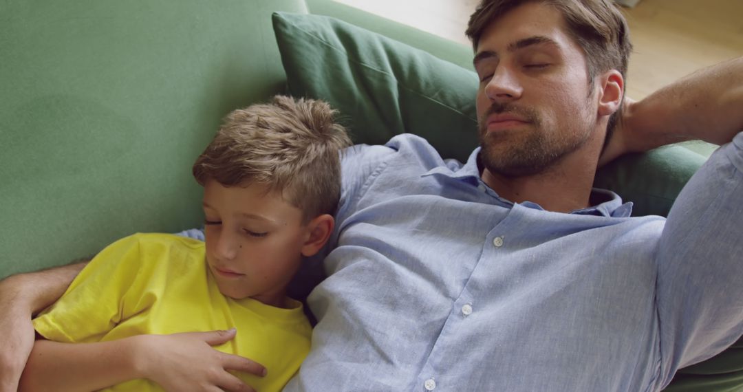 Father and Son Napping Together on Couch - Free Images, Stock Photos and Pictures on Pikwizard.com