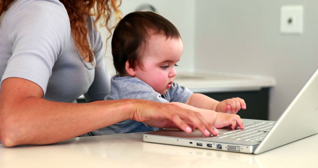 Mother With Baby Using Laptop At Home Office - Free Images, Stock Photos and Pictures on Pikwizard.com