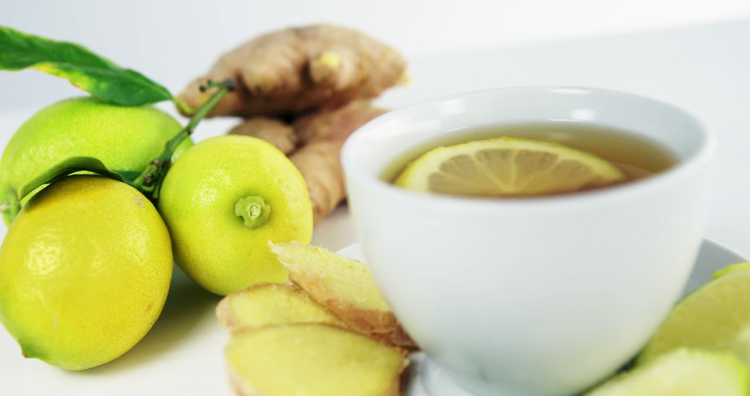 A tea with lemon and ginger represents a focus on natural wellness. - Free Images, Stock Photos and Pictures on Pikwizard.com