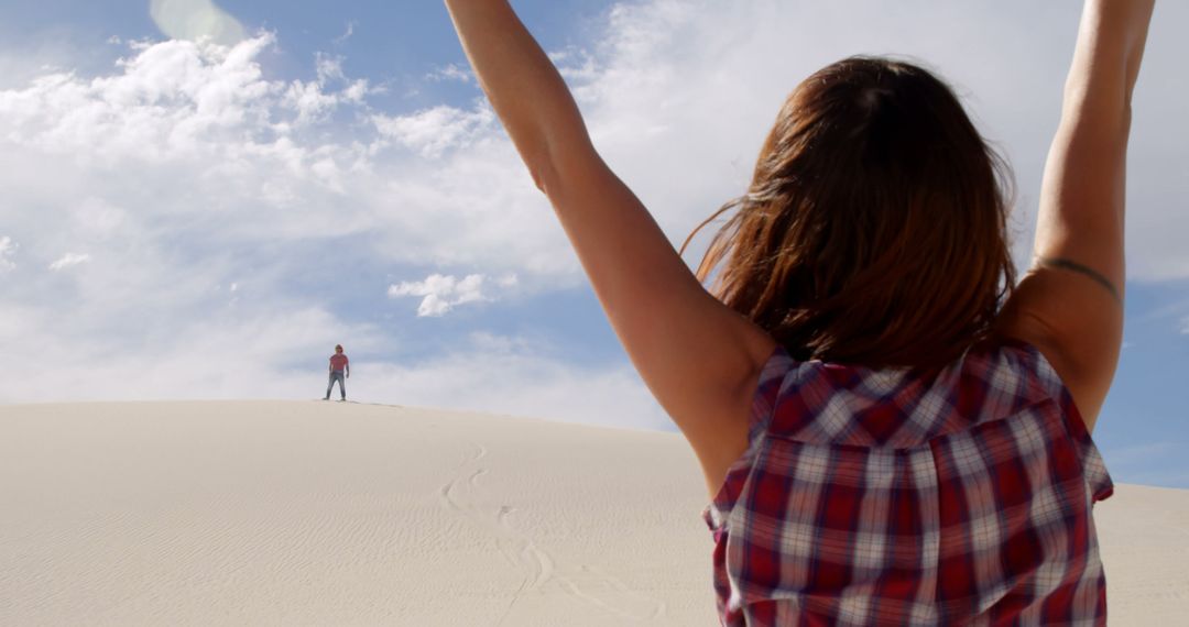 Excited Woman with Arms Raised Looking at Desert Dune - Free Images, Stock Photos and Pictures on Pikwizard.com