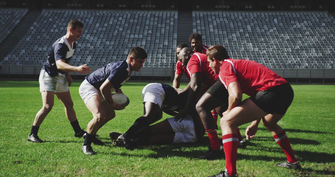 Intense Rugby Match with Players Tackling and Running on Field - Free Images, Stock Photos and Pictures on Pikwizard.com