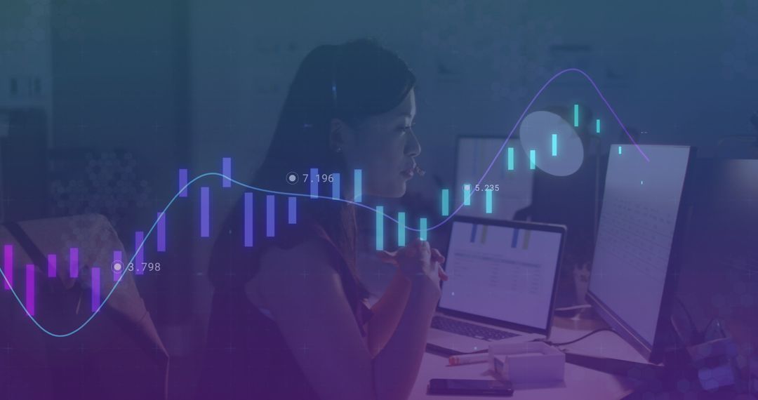 Businesswoman Analyzing Data with Advanced Graphs and Charts in Office