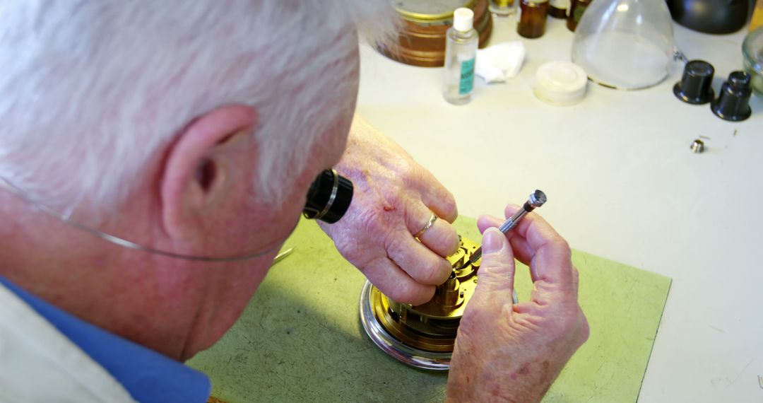 Senior Watchmaker Repairing Vintage Mechanical Watch at Workshop - Free Images, Stock Photos and Pictures on Pikwizard.com