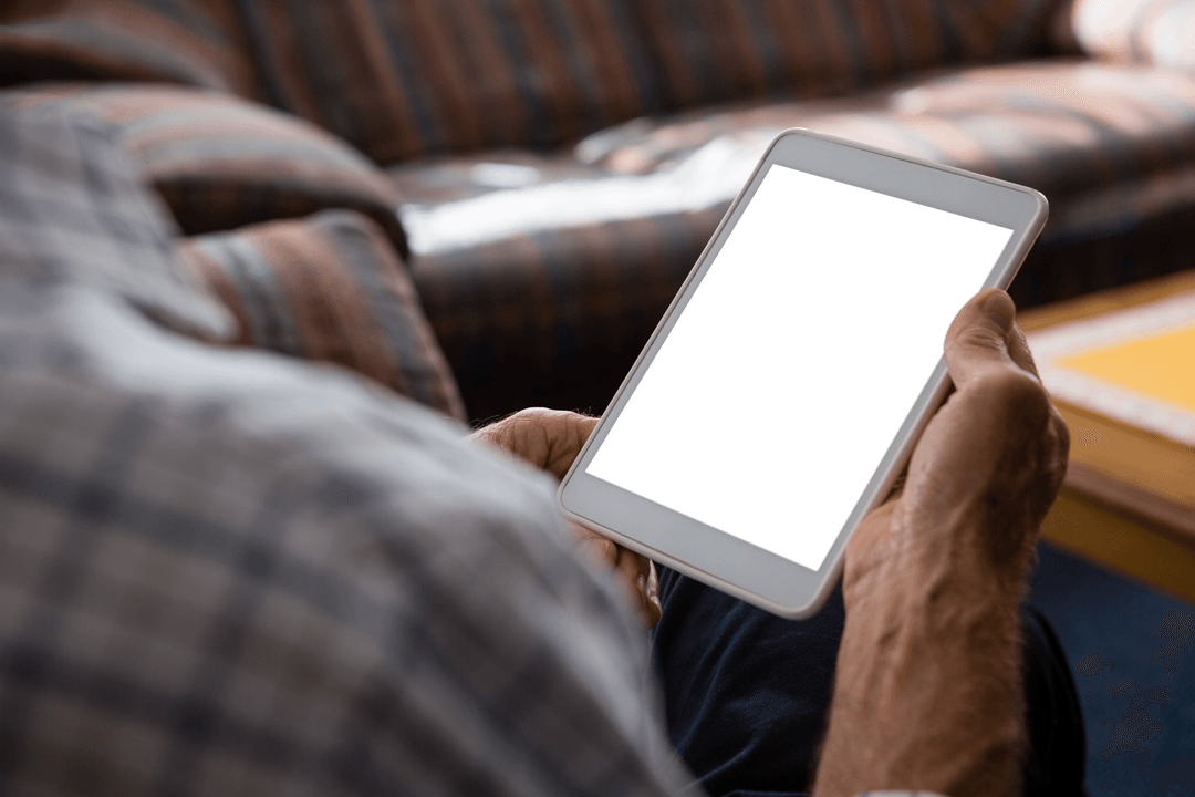 Elderly Man Using Digital Tablet Home Setting Transparent Screen