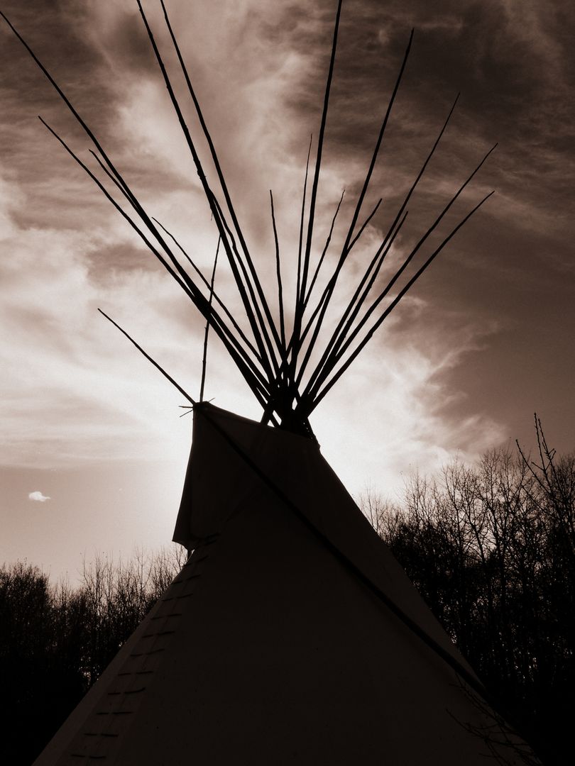 Silhouette of a Teepee Against Dramatic Sky at Sunset - Free Images, Stock Photos and Pictures on Pikwizard.com