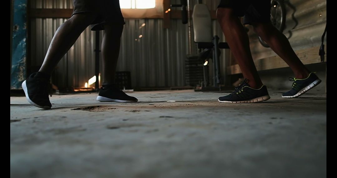 Boxer Training Footwork Skills with Coach in Industrial Style Gym