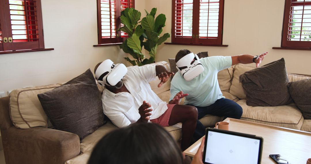 Friends Using VR Headsets for Virtual Reality Experience at Home