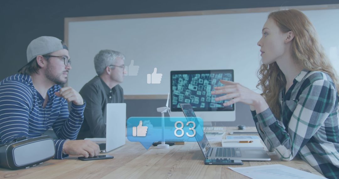 Young Professionals Analyzing Social Media Engagement Data in Modern Office