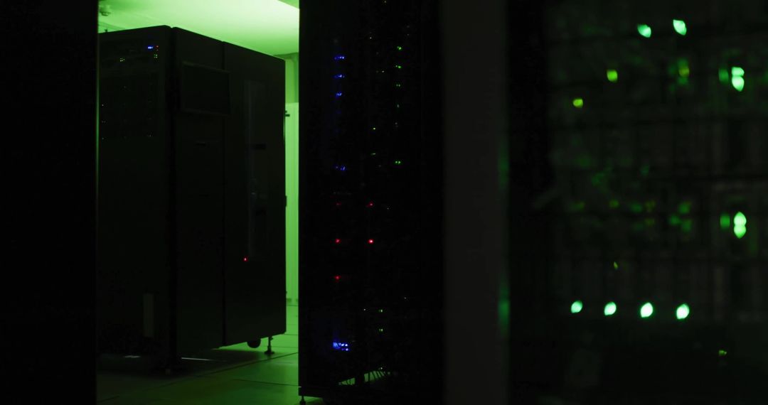Dimly Lit Server Room with Glowing Green LEDs and Shadowy Servers