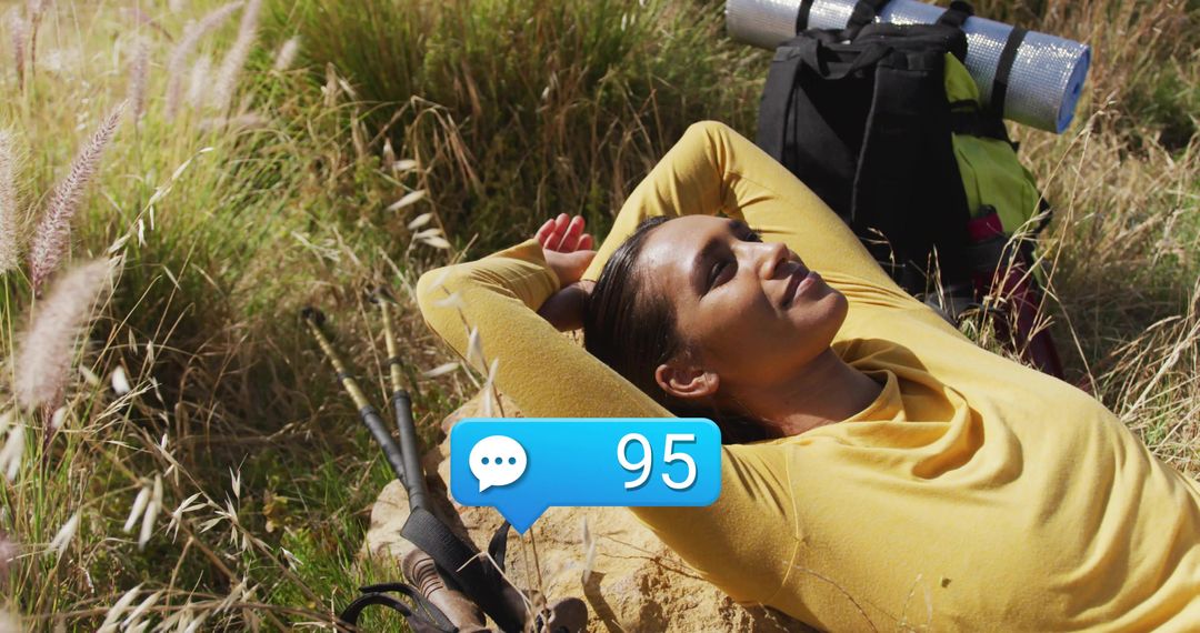 Serene Rest During Hiking Adventure in Grassy Hillside