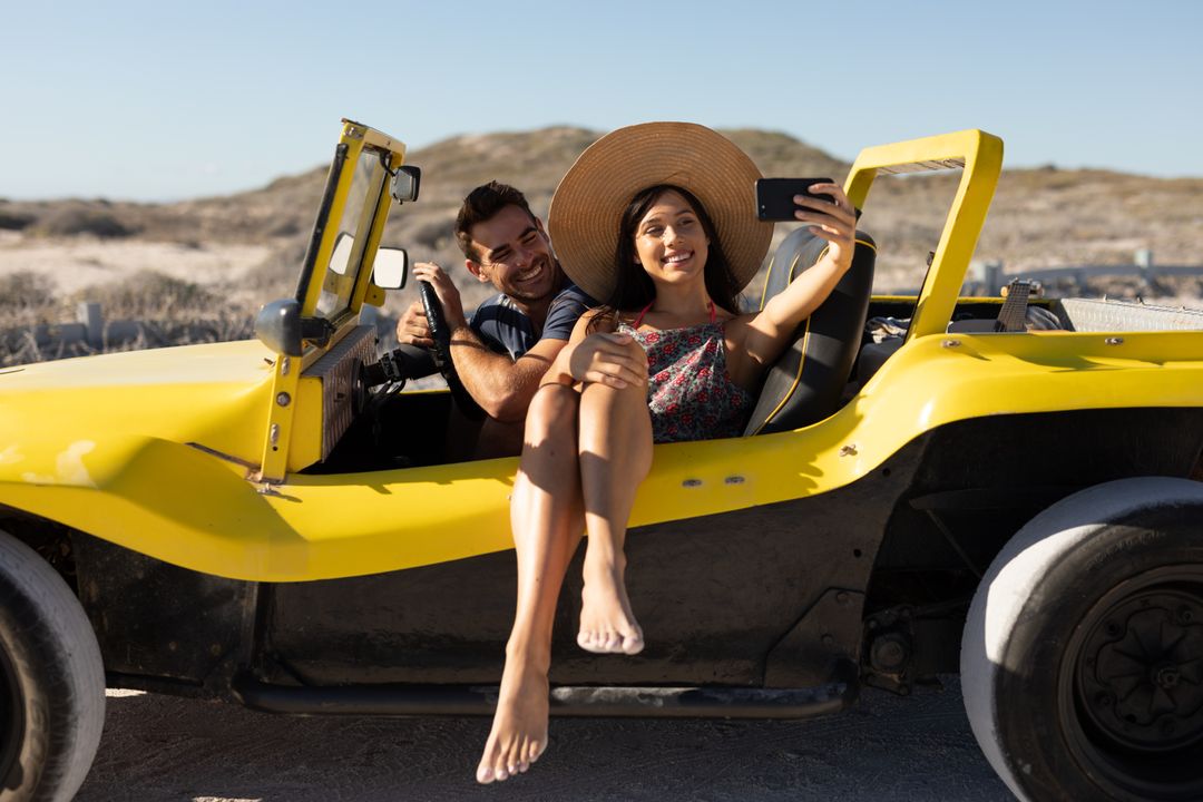 Happy Couple Taking Selfie in Yellow Beach Buggy - Free Images, Stock Photos and Pictures on Pikwizard.com
