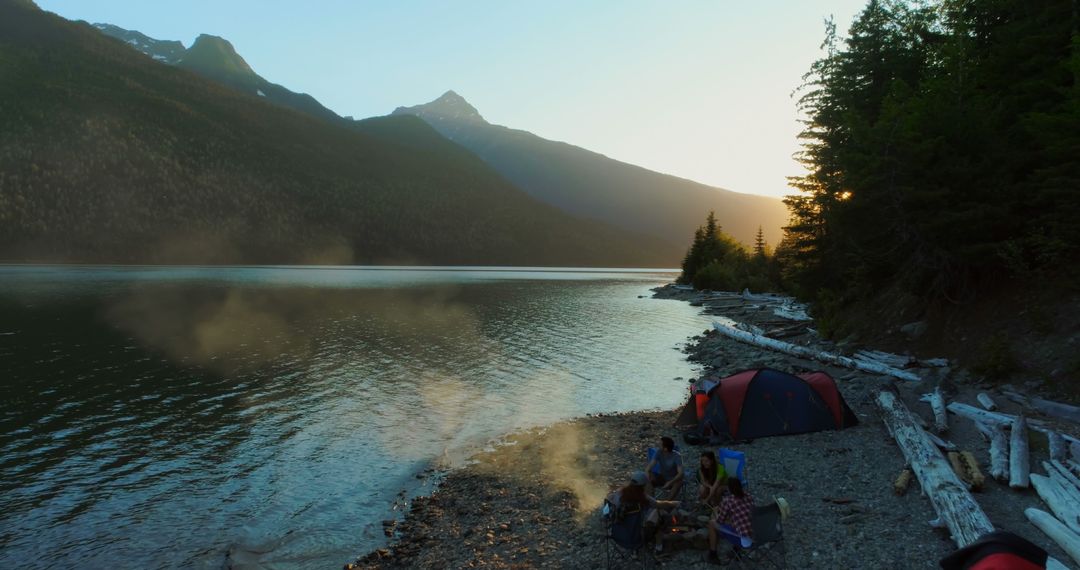 Morning Camping By Mountain Lake with Mist Rising - Free Images, Stock Photos and Pictures on Pikwizard.com