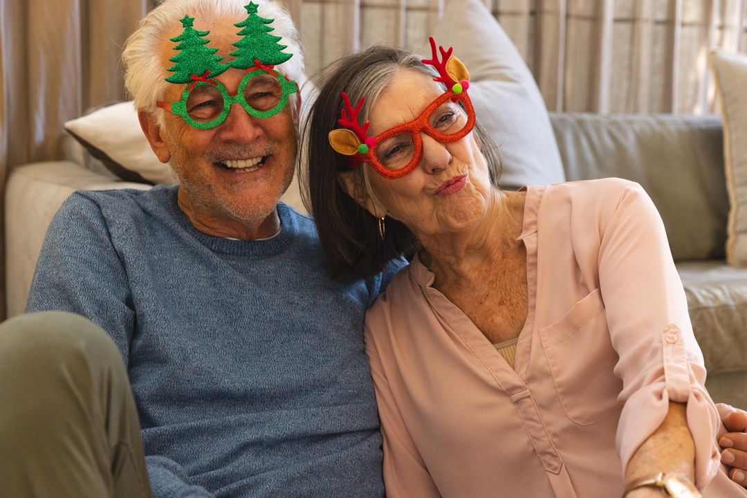 Senior Couple Relaxing with Festive Glasses and Smiling Cheerfully