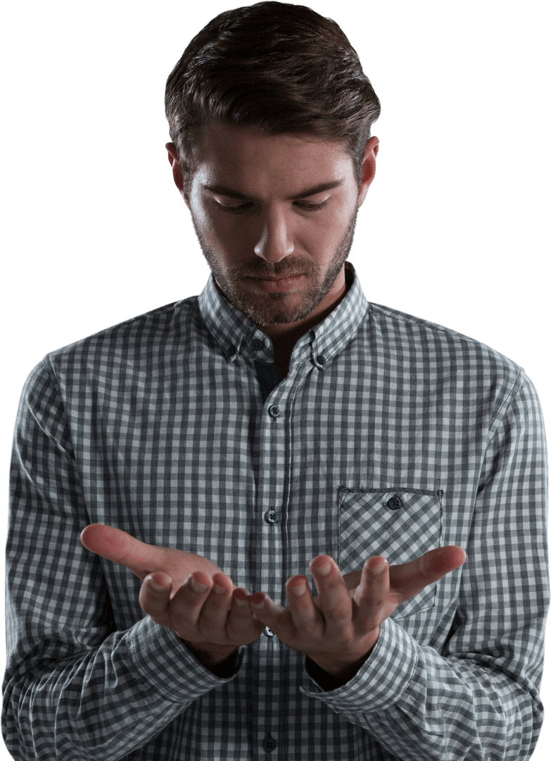 Man Gazing at Empty Hands in Transparent Fashion