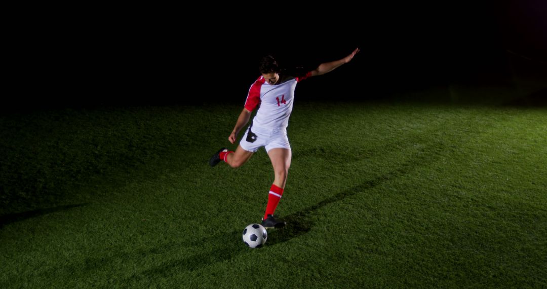 A soccer player trains at night, embodying the sport's energy and dedication. - Free Images, Stock Photos and Pictures on Pikwizard.com