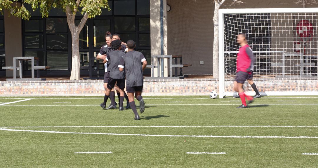 Soccer Players Warming Up on Field for Intense Practice Session