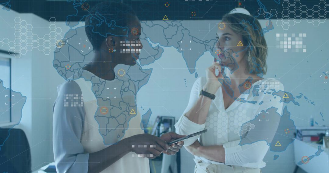 Businesswomen Discussing Data Analytics with Global Map Overlay