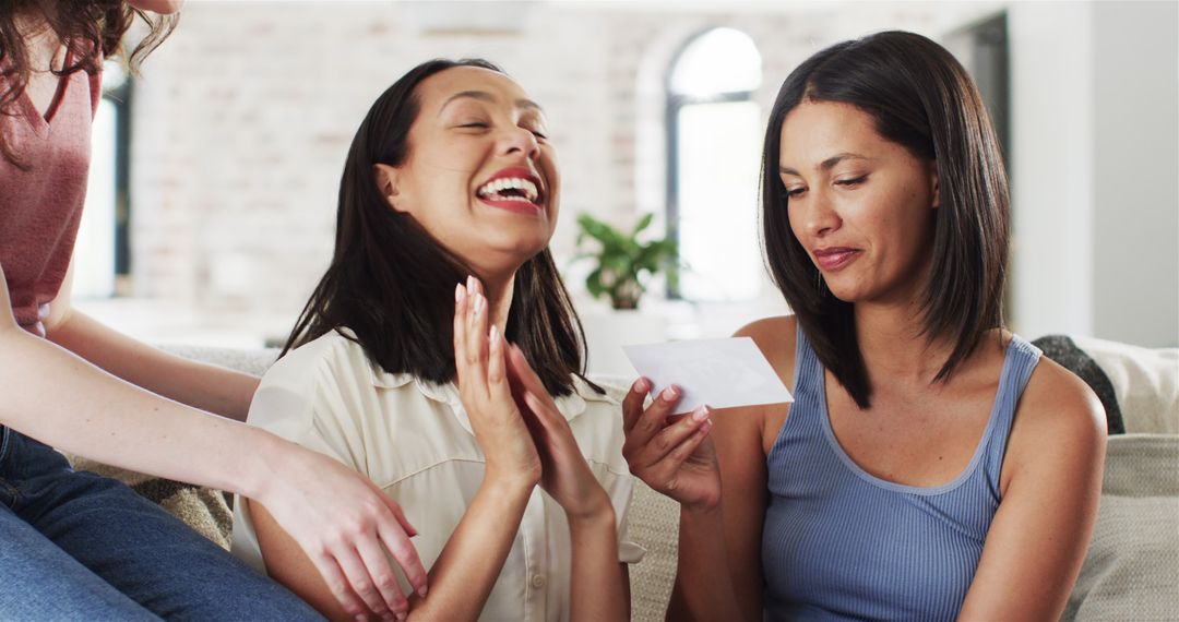 Women Celebrating Pregnancy Announcement Together at Home