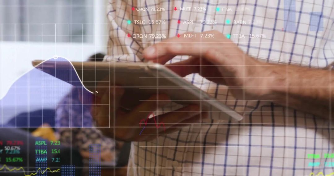 Businessman Analyzing Financial Data on Tablet Device