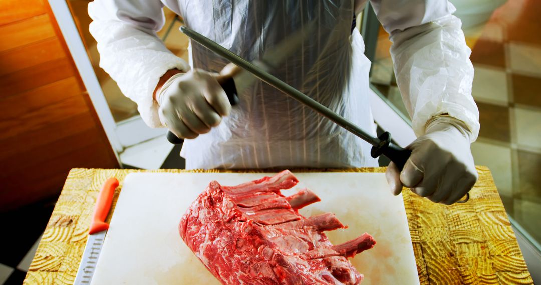 Butcher Sharpening Knife Preparing Fresh Raw Meat Cuts - Free Images, Stock Photos and Pictures on Pikwizard.com