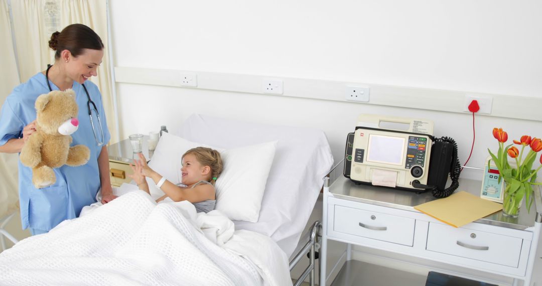 Nurse Caring for Young Patient in Hospital Room - Free Images, Stock Photos and Pictures on Pikwizard.com