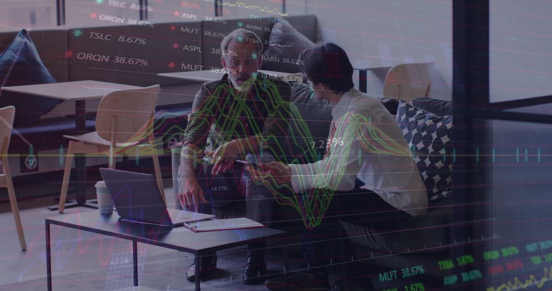 Business Partners Analyzing Stock Data in Modern Office Environment