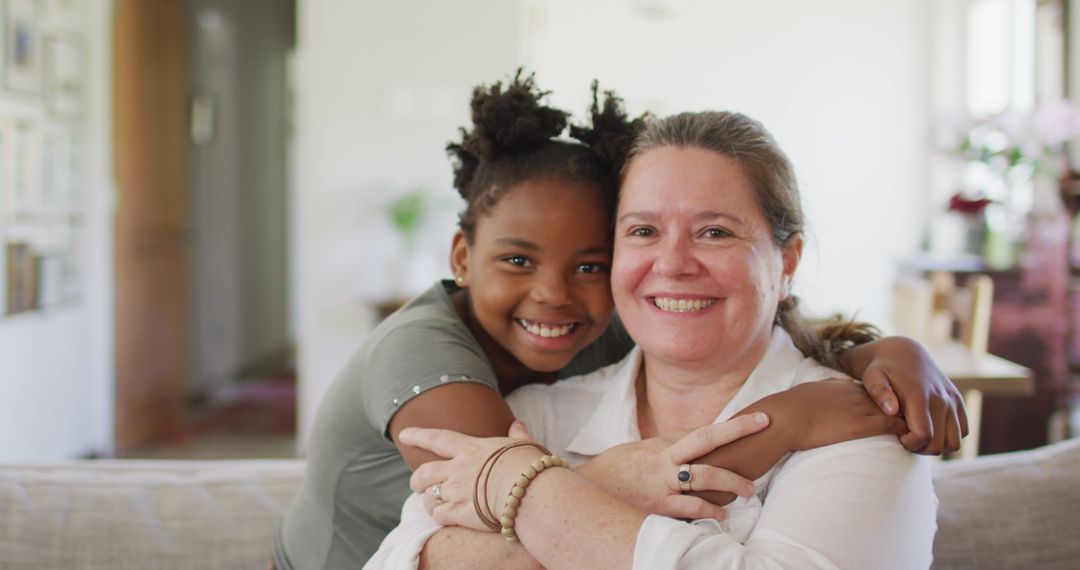 Multicultural Family Embracing and Smiling at Home