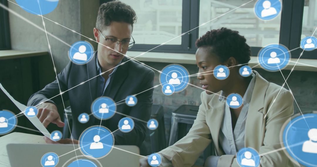 Connected Icons Overlay on Diverse Team Consulting in Office Environment