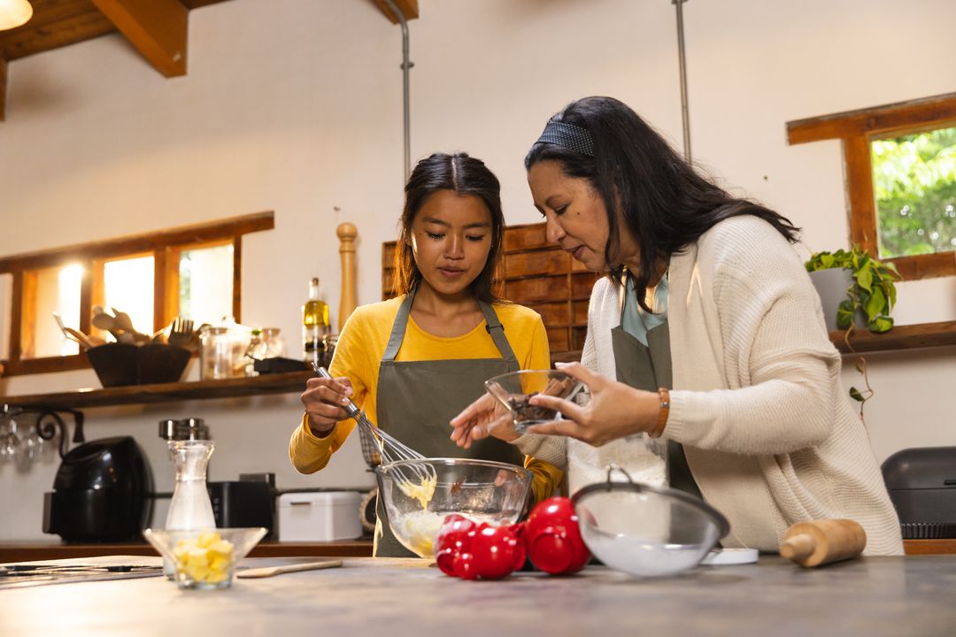Mother and Daughter Cooking in Rustic Home Kitchen
