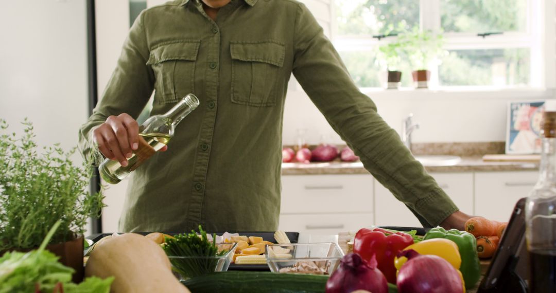 Woman Preparing Fresh Vegetables in a Bright Kitchen - Free Images, Stock Photos and Pictures on Pikwizard.com