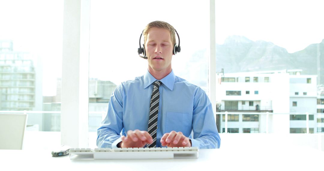 Customer Service Representative Wearing Headset in Bright Office - Free Images, Stock Photos and Pictures on Pikwizard.com