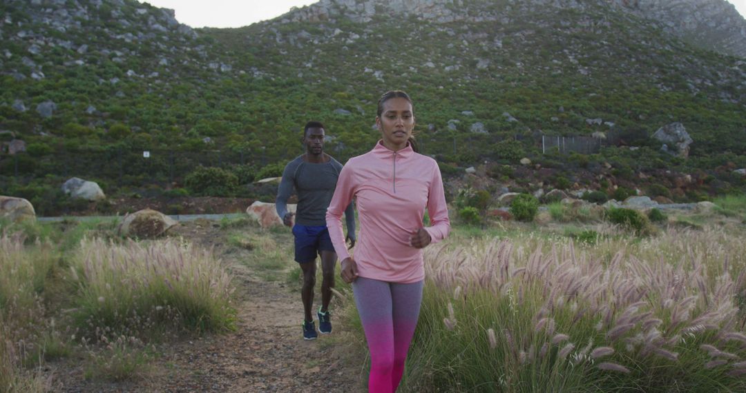 Couple Jogging on Scenic Mountain Trail - Free Images, Stock Photos and Pictures on Pikwizard.com