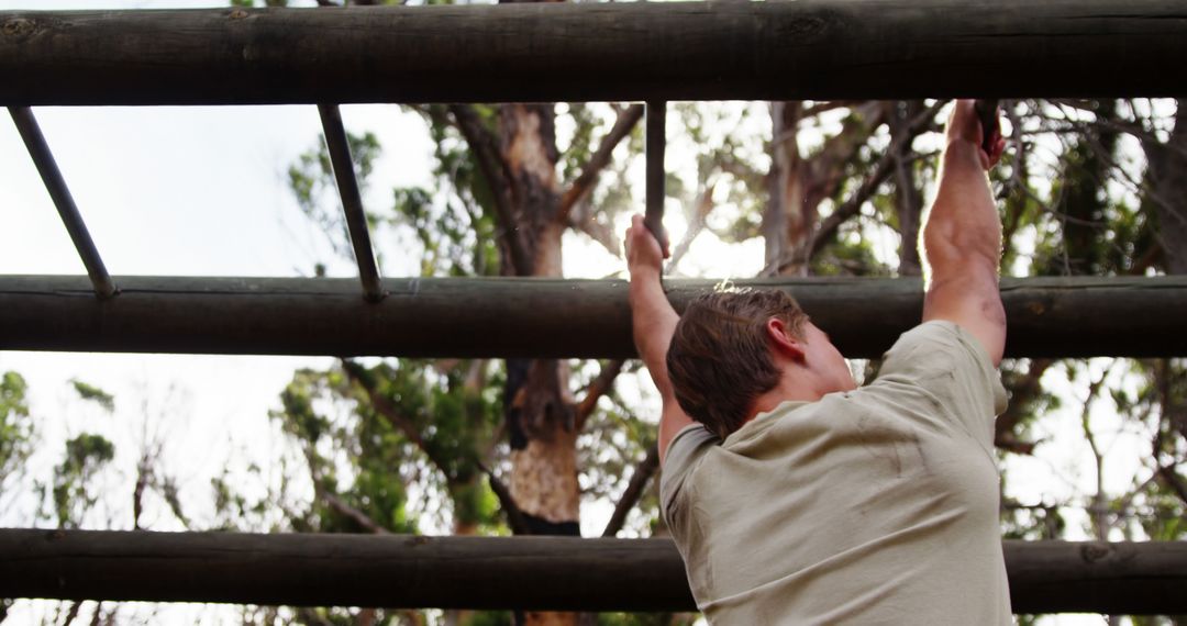 Man Conquering Monkey Bars in Outdoor Park - Free Images, Stock Photos and Pictures on Pikwizard.com