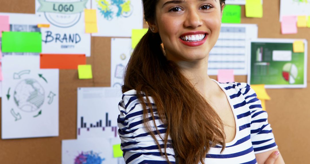 Confident Female Entrepreneur Smiling in Creative Office Environment - Free Images, Stock Photos and Pictures on Pikwizard.com