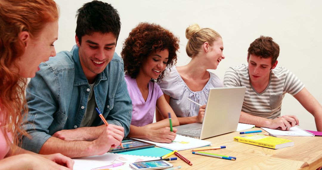 Group of Young Students Collaborating on Homework Project Together - Free Images, Stock Photos and Pictures on Pikwizard.com