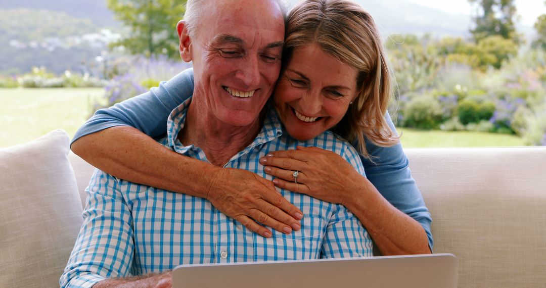 Happy Senior Couple Enjoying Online Browsing
