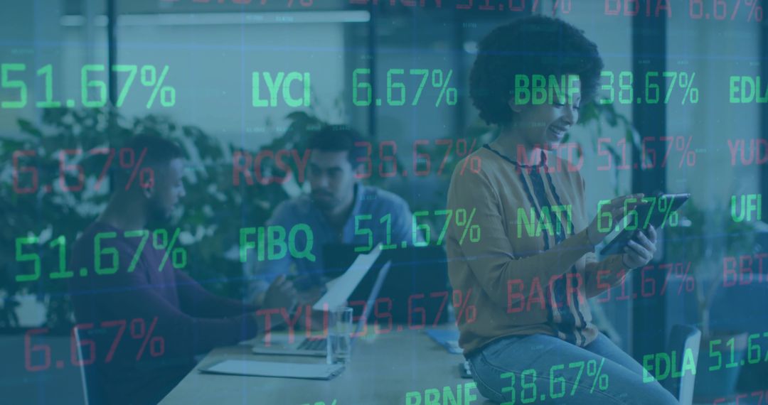 Curly-haired woman using tablet in collaborative office with stock ticker overlay