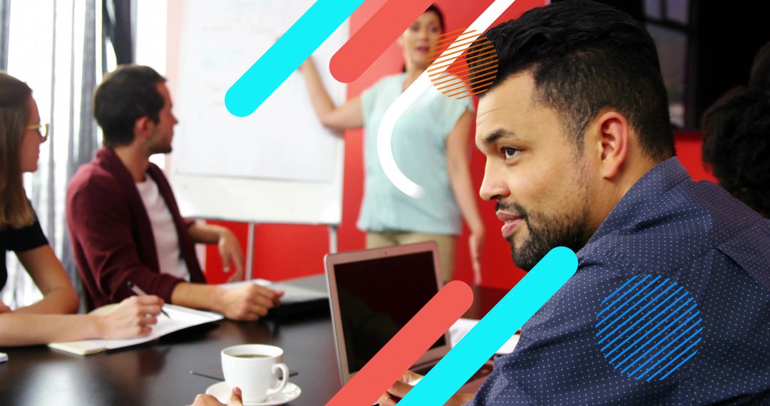 Young Professionals Collaborating in Modern Office with Laptop