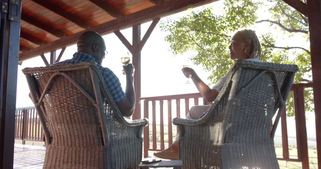 Couple Relaxing with Wine on Porch with Scenic View - Free Images, Stock Photos and Pictures on Pikwizard.com