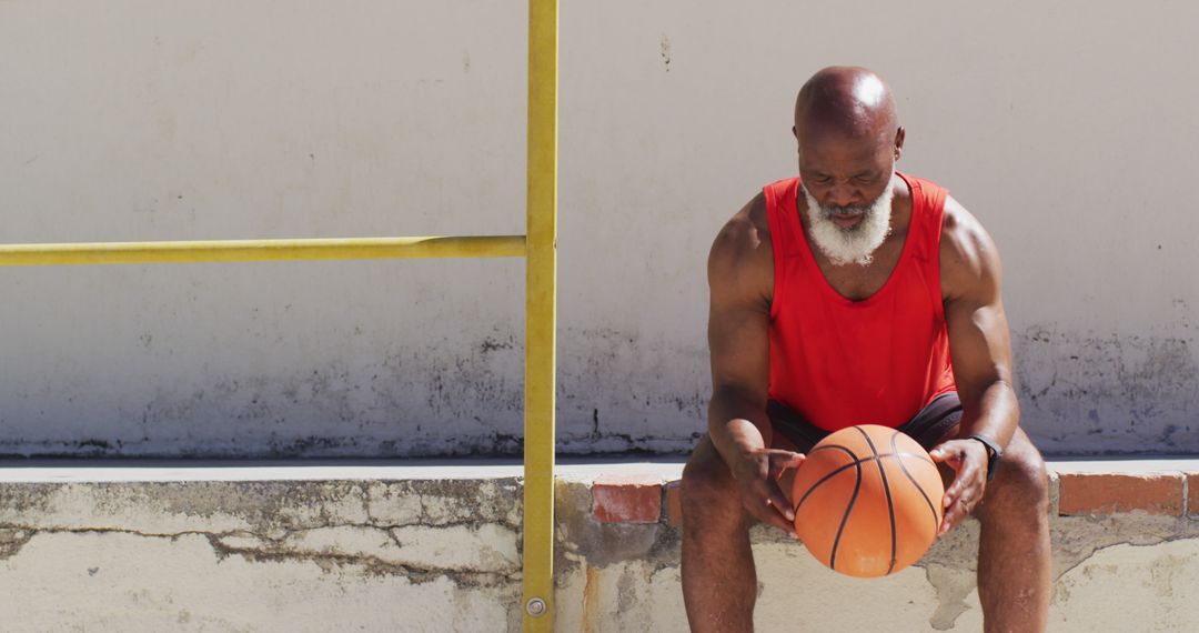 Senior Athlete Resting with Basketball in Urban Setting - Free Images, Stock Photos and Pictures on Pikwizard.com