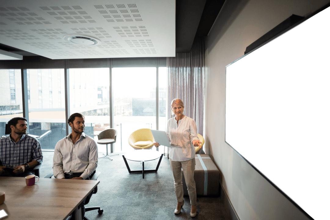 Businesswoman Leading Presentation with Transparent Display in Modern Office