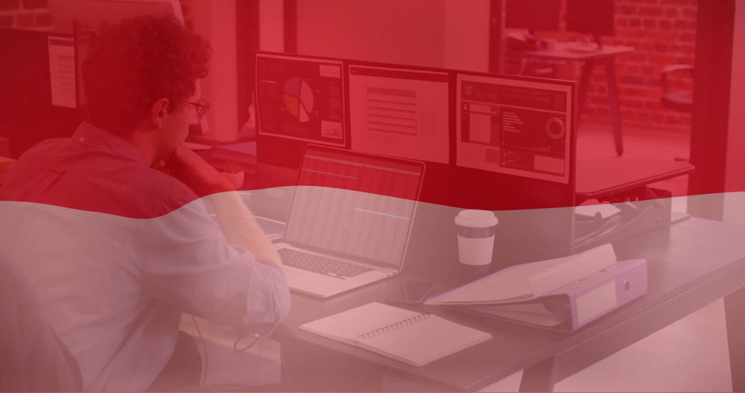 Businessman Working With Indonesian Flag Overlay in Office