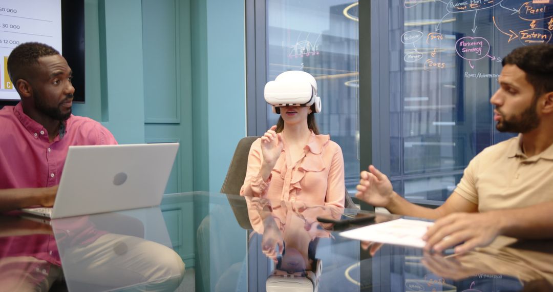 Colleagues Discussing VR Technology in Modern Office